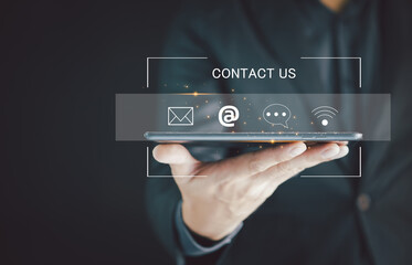 Contact us or Customer support hotline people connect. Businessman using a laptop and touching on virtual screen contact icons. Contact Us Customer Support Inquiry Hotline Concept.
