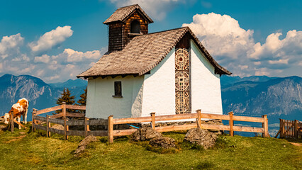 Alpine summer view with cows and a chapel at Mount Markbachjoch, Niederau, Wildschoenau, Tyrol,...