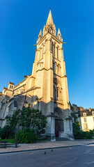 Fototapeta na wymiar Huge tower of the medieval church of St. Martin in the center of the tourist city of Pau, France.