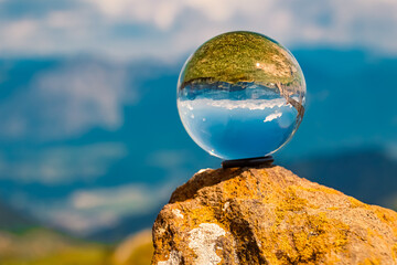 Crystal ball alpine summer landscape shot at Mount Markbachjoch, Niederau, Wildschoenau, Tyrol, Austria