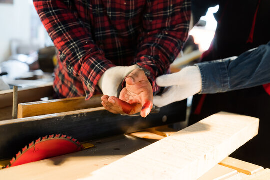 Injuries when working with a saw Barn place inside house, safety concept.