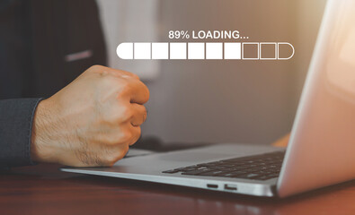 Businessman using smartphone and laptop uploading to cloud computing to download and loading data information and upload on system network application.
