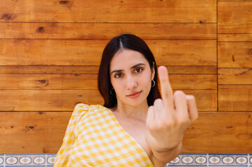 Rude woman showing the index finger to the camera