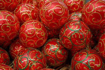 Bright red decorated Christmas glass balls put on a counter