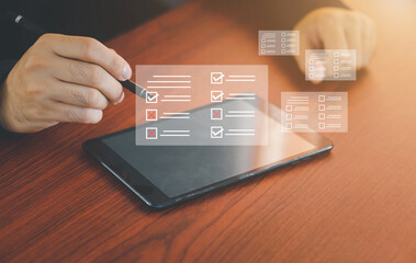 Businessman Take an assessment, questionnaire, evaluation, online survey, online exam Choosing the right answer in the exam.