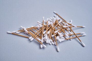 Bamboo cotton buds on a colored background. Biodegradable ear swabs. Eco product