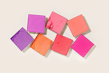 Pink purple colored eyeshadows powder close-up texture, swatches of eye shadow powder or blusher,...