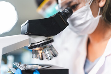 Health care researchers working in life science laboratory, medical science technology research...