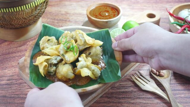 Fried bakso and tofu or Batagor is a traditional food from Indonesia made of fish tapioca seasoning dumplings spicy peanut sauce