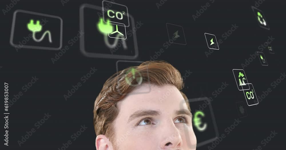 Wall mural Animation of multiple digital icons over caucasian man looking upwards against grey background