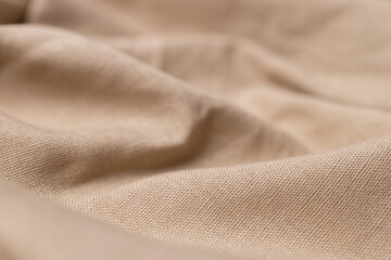Natural linen fabric texture. Rough crumpled burlap background. Selective focus