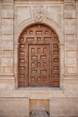 Small wooden door on the facade of the Cathedral of Burgos