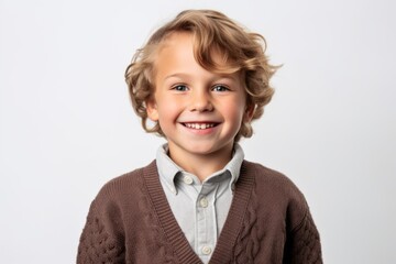 Portrait of a cute little boy with blond hair on a white background