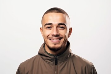 Obraz premium Portrait of a smiling young man in a hoodie on a white background
