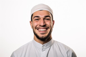 Portrait of a handsome young muslim man wearing traditional clothes, isolated on white background