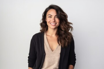 Obraz premium Portrait of a beautiful young woman with long wavy hair.