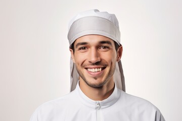 Portrait of a smiling muslim man isolated on a white background