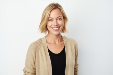 Portrait of a smiling young woman looking at camera over white background