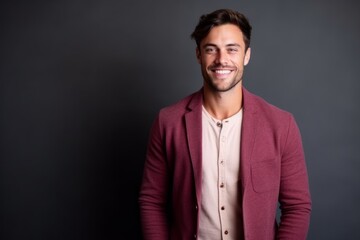 Fototapeta premium Portrait of a handsome young man smiling and looking at the camera
