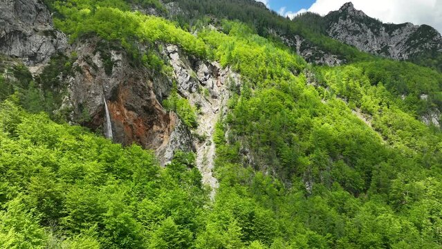 Rinka Falls in the Logar Valley (Logarska dolina) in the Kamnik Savinja Alps in Slovenia during a beautiful springtime day.