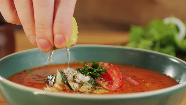 Tomato gazpacho Spanish cold soup with pepper and garlic, Spanish traditional cuisine, chef cooking dinner.