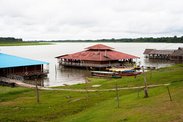 pucallpa peru, yarinococha lagoon tourist place with boats and restaurant on the river coast
