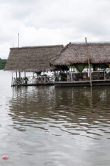 Fototapeta premium pucallpa peru, yarinococha lagoon tourist place with boats and restaurant on the river coast