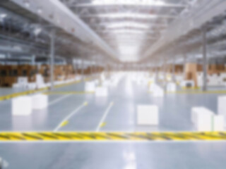 Blurred  A warehouse where the goods are packed in a large number of brown cardboard boxes.