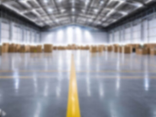 Blurred  A warehouse where the goods are packed in a large number of brown cardboard boxes.