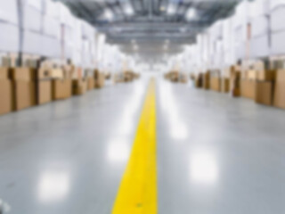 Blurred  A warehouse where the goods are packed in a large number of brown cardboard boxes.