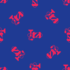 Red Spinning reel for fishing icon isolated seamless pattern on blue background. Fishing coil. Fishing tackle. Vector