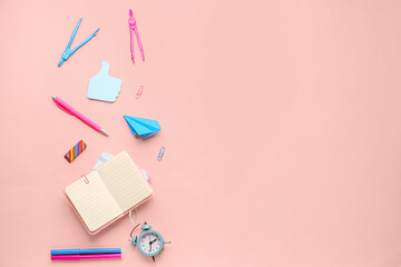 Composition with blank notebook and stationery supplies on pink background
