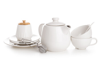 Ceramic teapot with cups, sugar bowl, tea infuser and saucers on white background