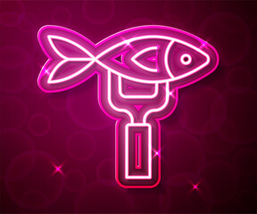 Glowing neon line Dried fish icon isolated on red background. Vector