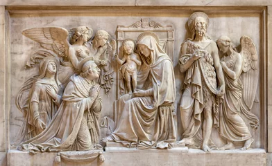 Tuinposter GENOVA, ITALY - MARCH 6, 2023: The marbel relief of Madonna with the saints and angels in the church Basilica della Santissima Annunziata del Vastato by Santo Varni (1807 - 1885). © Renáta Sedmáková
