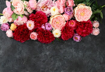 Floral arrangement with place for text, beautiful peony flowers on old dark background grunge ,summer banner,floral greeting card for wedding,birthday,template for design,selective focus