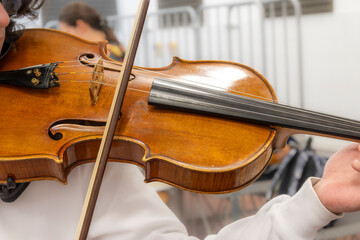 Real life young music students during rehearsals. Musical instruments and music stand with stave.