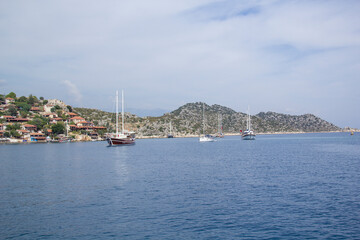 Naklejka premium Beautiful view of the sea bay and pleasure yachts on a sunny summer day, in Turkey