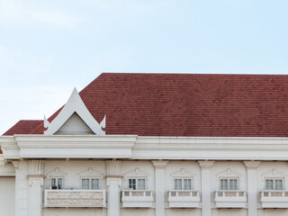 vibrant red tile roof stood proudly atop the house, its distinct color adding a touch of warmth and...