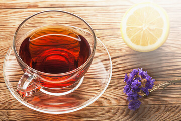 tea in cup of glass on a wooden background
