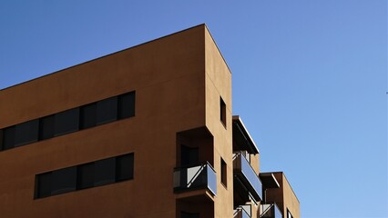 corner of modern residential building facade against the sky