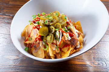 A view of a bowl of Korean BBQ nachos.
