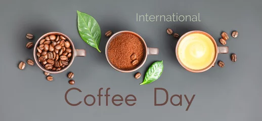 Coffee composition with three cups of coffee on dark background, banner, coffee day concept © Natalia Klenova