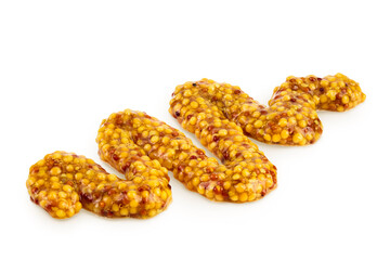 Bowl with french mustard isolated on white background with full depth of field. Top view. Flat lay.