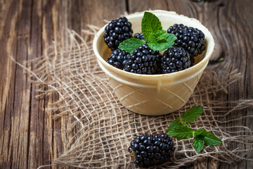 Blackberries, raspberries and blueberries in a waffle bowls.