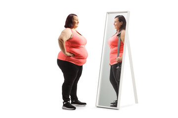 Overweight woman looking at a slimmer version of herself in the mirror - obrazy, fototapety, plakaty