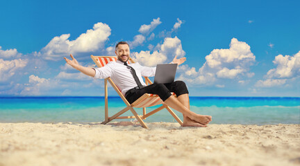 Bussinesman sitting on a deck chair and working remotely