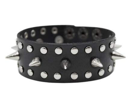 Black leather bracelet with spikes, holnitenes. An accessory for rockers, bikers, metalheads, goths and punks. Steampunk style. Close-up subject photography.