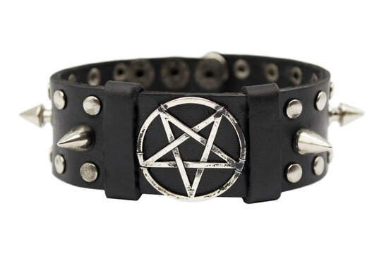 Black leather bracelet with spikes, holnitenes and a pentagram. An accessory for rockers, bikers, metalheads, goths and punks. Steampunk style. Close-up subject photography.