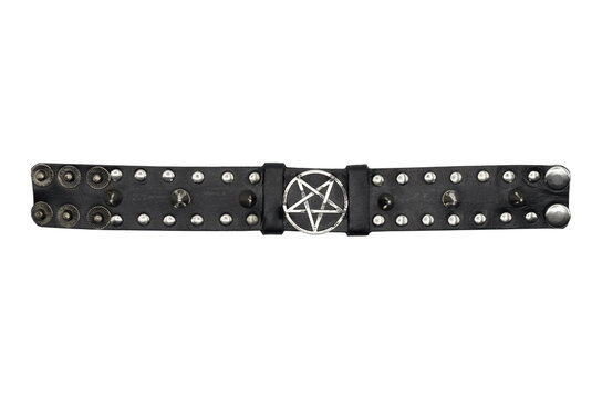 Black leather bracelet with spikes, holnitenes and a pentagram. An accessory for rockers, bikers, metalheads, goths and punks. Steampunk style. Close-up subject photography.